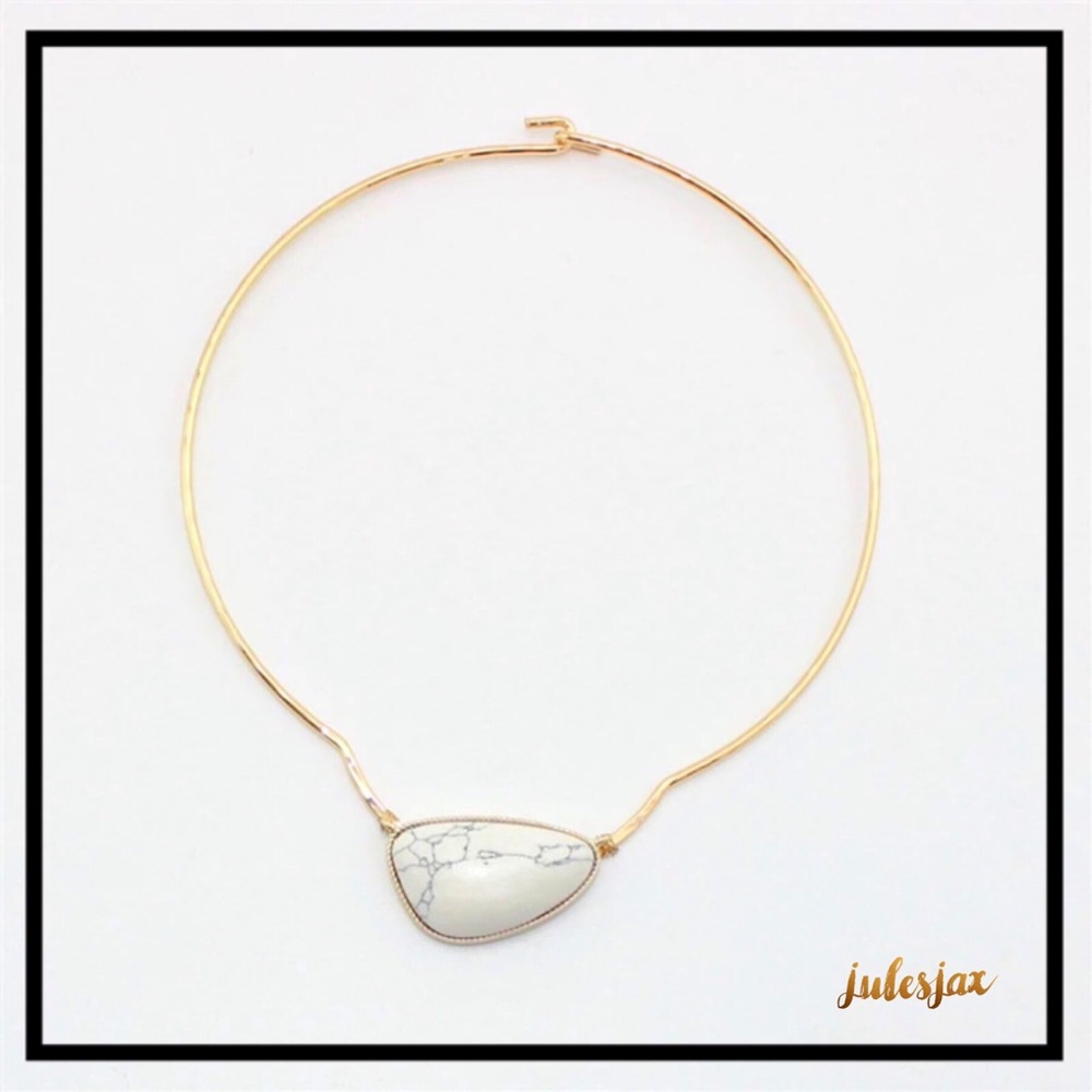 Marbled stone on gold wire necklace collar bone